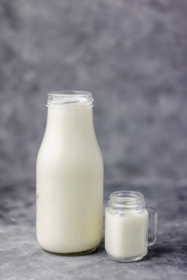 Vanilla coffee creamer in a milk bottle and little mason jar.