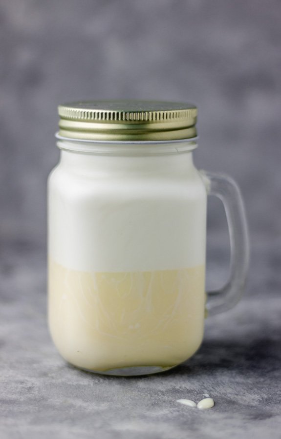 Milk and condensed milk in a tightly closed mason jar.