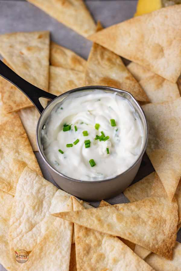 sour cream and chive dip served with homemade baked tortilla chips.