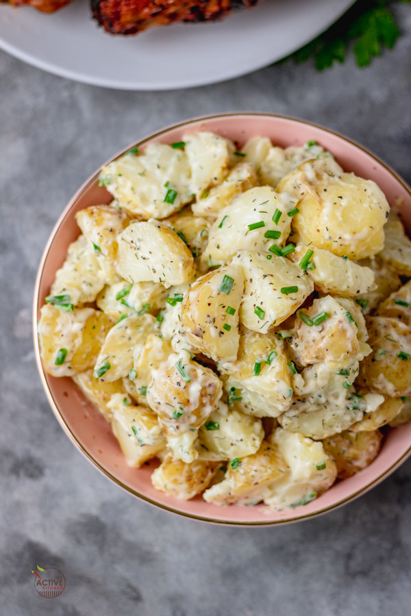 overhead shot of creamy potato salad and chives.