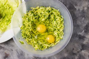 zucchini and eggs in a bowl.