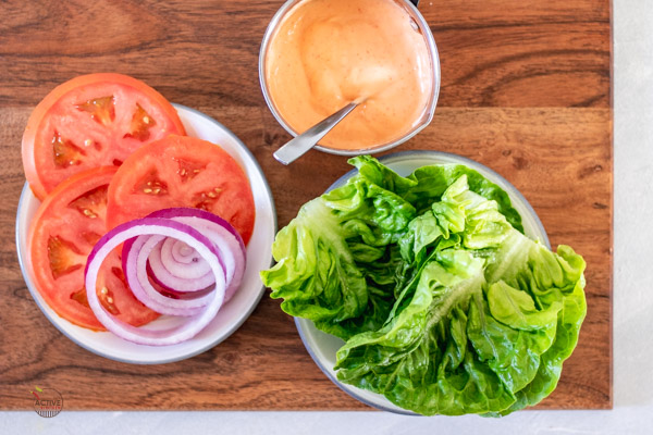 sliced onions, tomatoes, lettuce and spicy-mayo.