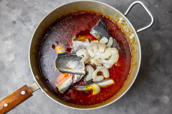 addition of catfish and fresh shrimps to soup.