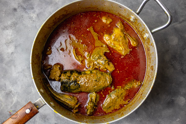 freshly cooked Nigerian Niger-Delta Banga soup still in a large pot.