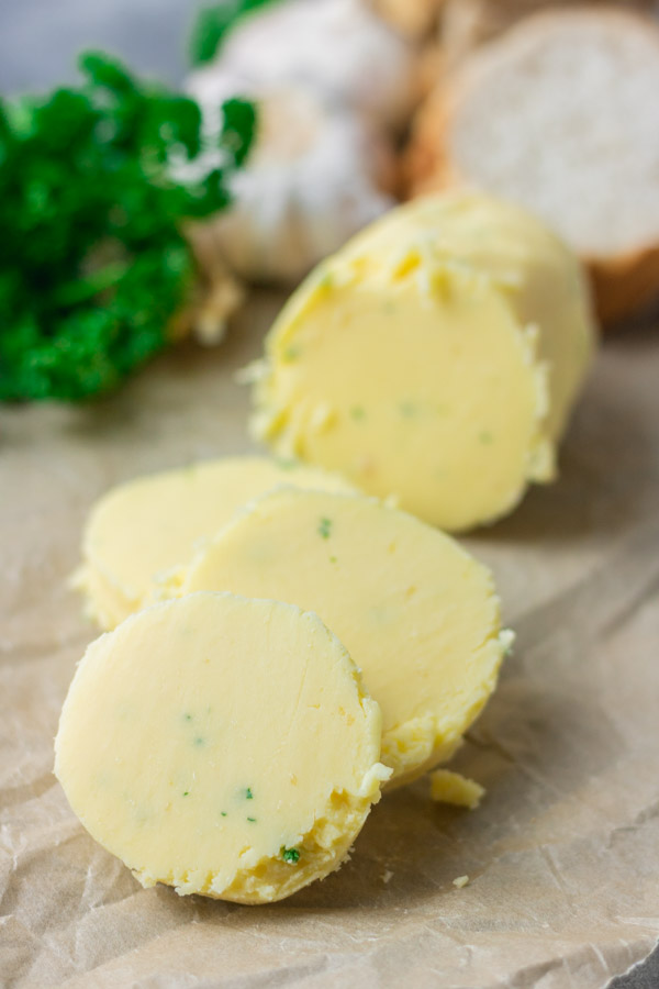 log of roasted garlic butter with chopped parsley.