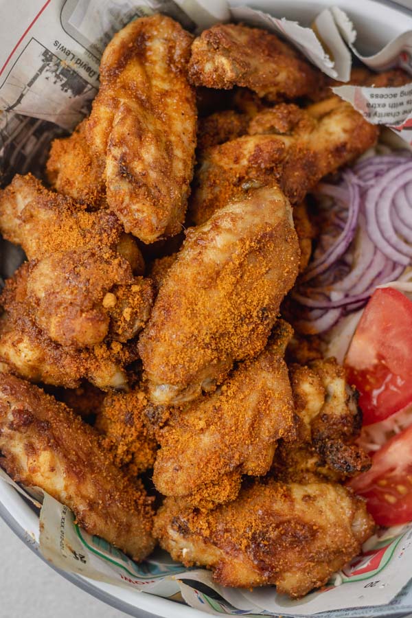 chicken wings served in a newspaper. 