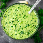 a small bowl with green herby sauce.