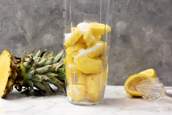 pineapple and sugar in a blender.