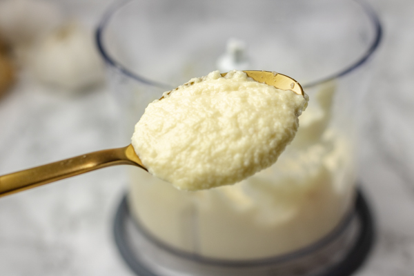 garlic paste on a spoon.