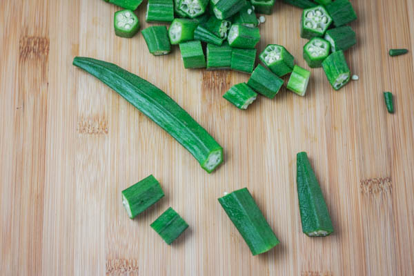 chopped lady's finger on a chopping board.