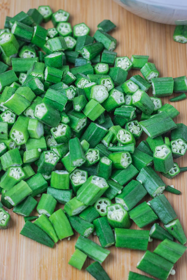 chopped okra on a chopping board. 