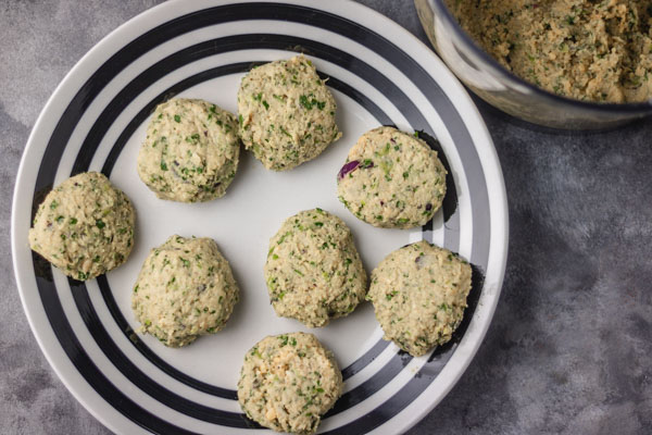 uncooked patties on a plate.