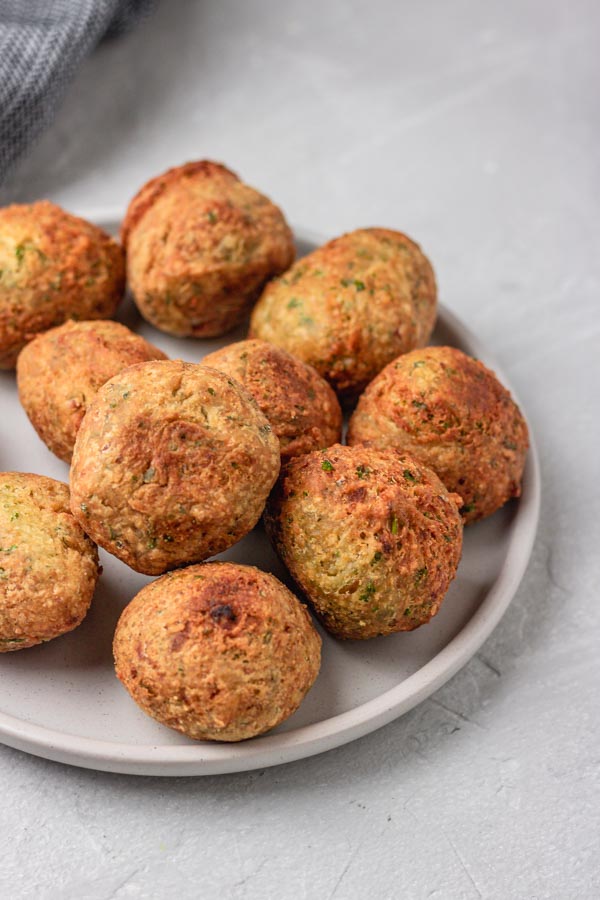 golden brown falafel balls on a plate.