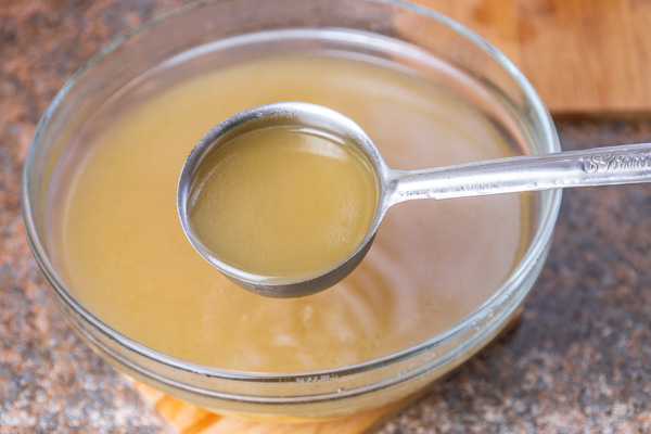 stock in a soup ladle.