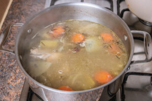 stock boiling in a pot.