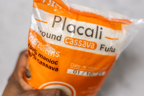 a hand holding a bag of placali.