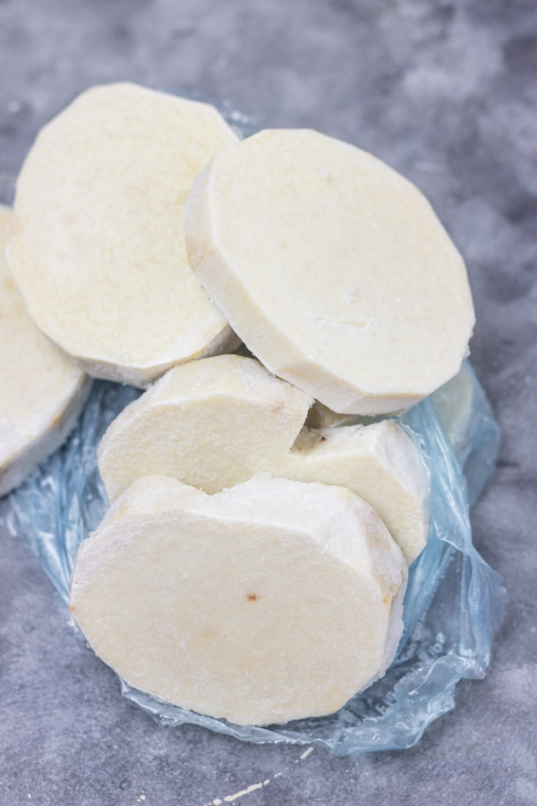 frozen African yam slices on a counter.